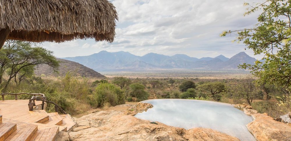 Image showing the view overlooking the vast plains visible from Sarara Camp in northern Kenya. Steps and an infinity pool are visible in the foreground | Planet Africa Safaris | Blog | Sarara Camp