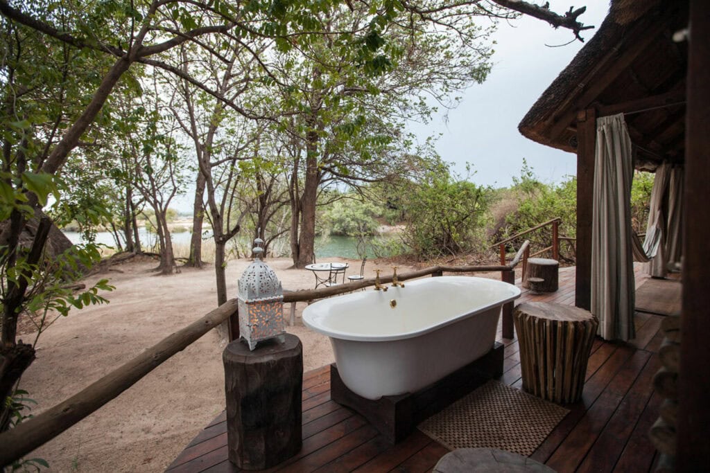 Image of the outdoor bathtub of the Honeymoon Chalet overlooking the Zambezi River at Sindabezi Island Camp in Zambia | Planet Africa/TrueAfrica Safaris | Blog | Green Safaris: Sidabezi Island Camp