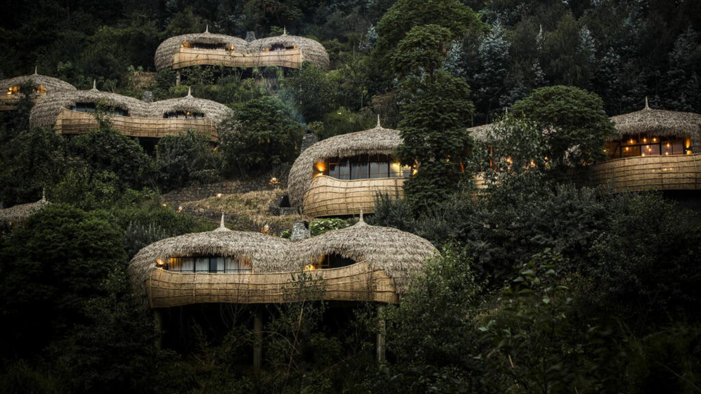 andBeyond's Bisate Lodge in Rwanda exterior shot of thatched pods | Africa's Top 6 Must-Visit Rooms in 2022 by Planet Africa Safaris | Tailormade safari itineraries